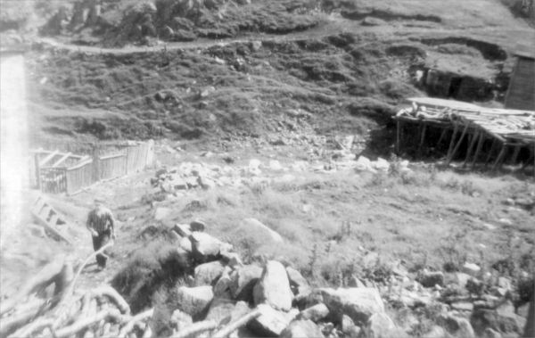 687: Joseph Kerrivan at front left. His cellar in the background. At Margarees Cove, Red Island.  (circa 1950-1960) [courtesy of Jenny (Kerrivan) Harvie]  - Son of John Kerrivan &amp;amp; Mary Anne Bavis, married Anne Green &amp;amp; Elizabeth Judge